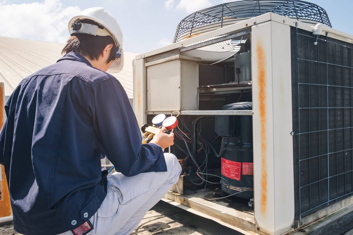 Genesis technician servicing a commercial system